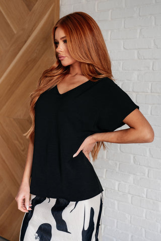Frequently Asked Questions V-Neck Top in Black-Tops-Ave Shops-Motis & Co Boutique, Women's Fashion Boutique in Carthage, Missouri